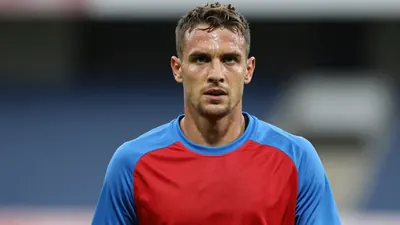 Mid-30s GIF Sundsvall forward, muscular, sweat-glossed skin, head-and-shoulders shot, intense eyes fixed on the camera...