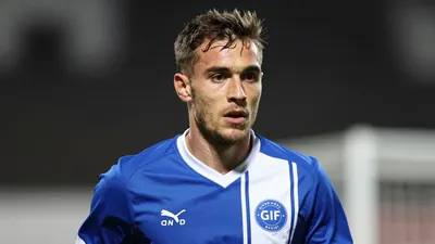 A photorealistic image of an anonymous GIF Sundsvall midfielder, aged 21-25, in a blue and white jersey, playing a...