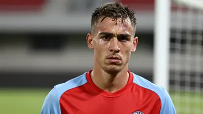 Mid-30s muscular GIF Sundsvall reserve midfielder, head-and-shoulders, eyes focused, slight frown after a goalless draw...